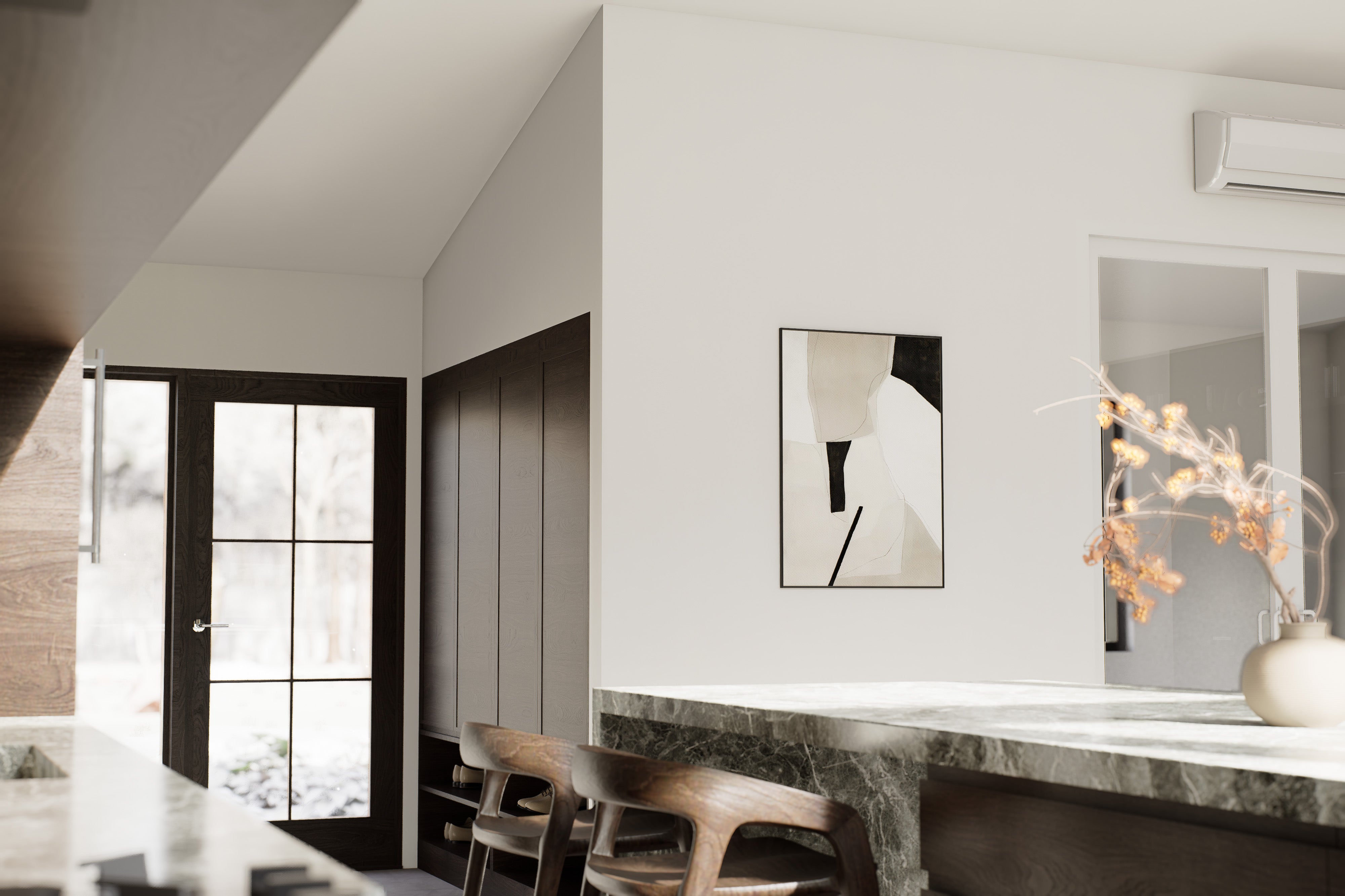 Interior view of 2 bedroom midcentury cabin floor plan showing glass-panel entry door, inclined ceiling, green marble kitchen island and built-in cabinetry