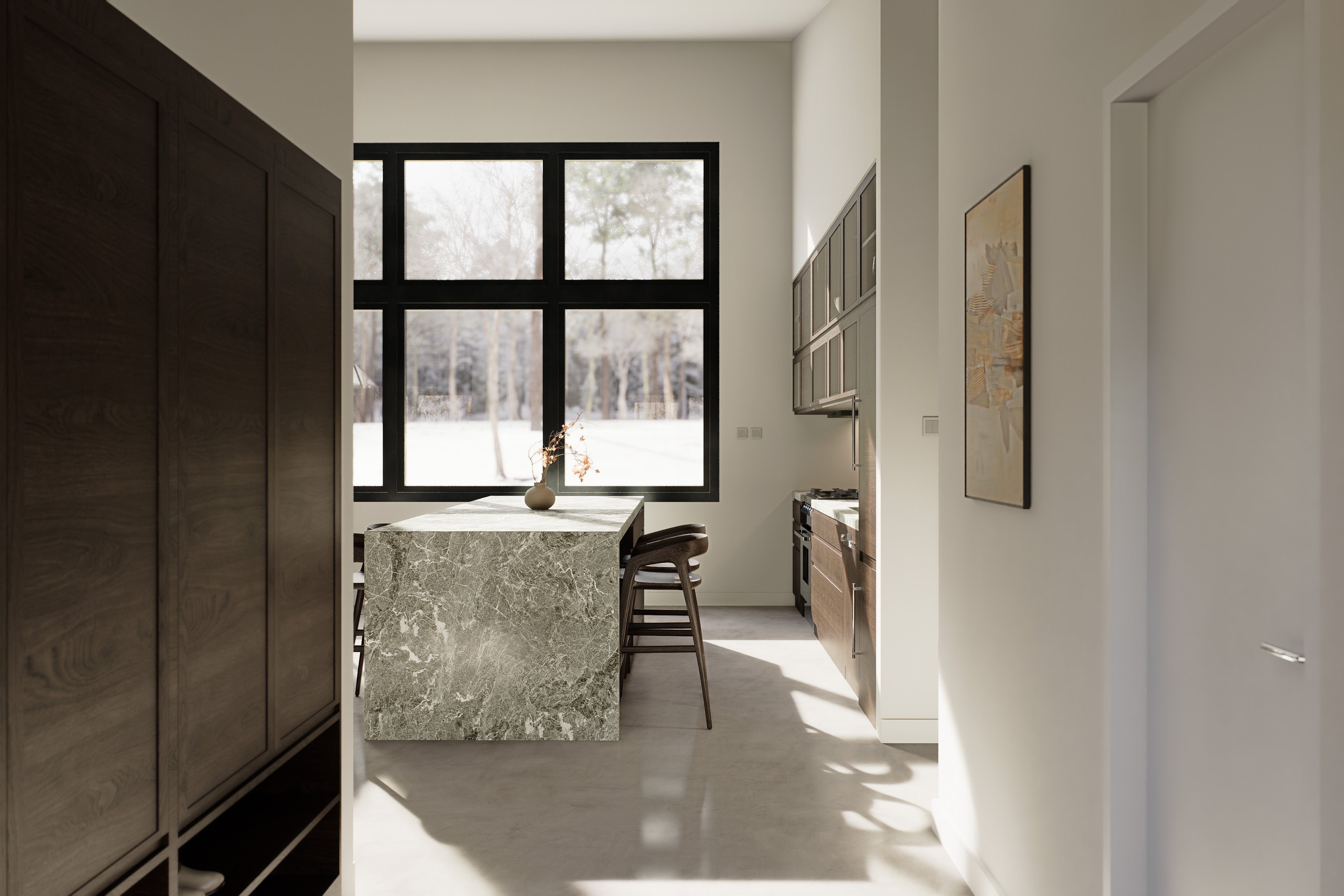 View from entry into kitchen of 2 bedroom midcentury cabin house plan featuring green marble island, dark cabinetry and black-frame window with winter forest views