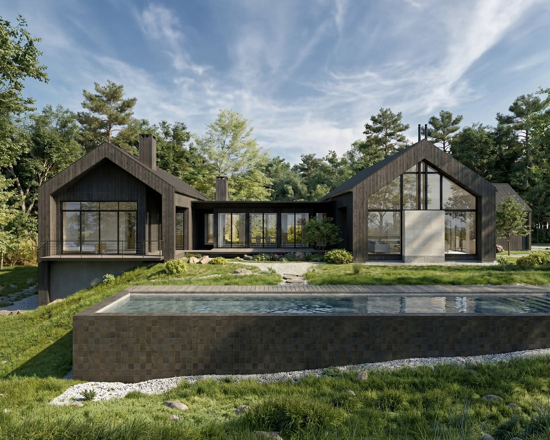 Modern dark wood farmhouse exterior with gable rooflines, floor-to-ceiling glazing, and lap pool in a wooded setting
