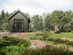 Micro cabin ADU exterior — compact steel cabin with French doors and standing seam roof