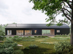 Modern dogtrot house plan exterior — Southern dogtrot home with central breezeway