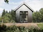 Micro steel cabin ADU exterior — 512 sqft tiny home in a garden setting