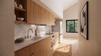 Garage apartment kitchen — 13'-11" galley run with oak cabinets, marble backsplash, cooktop, built-in oven and full-height refrigerator