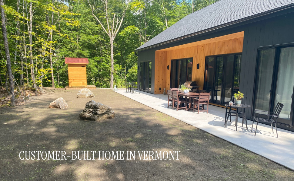 Customer-built 2 bedroom modern large cabin in Arlington, Vermont — real DesignwithFrank build with deep blue pine siding in the Green Mountain Forest