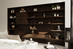 Living room detail of 2 bedroom midcentury cabin plan showing full-wall dark wood built-in shelving and freestanding wood stove