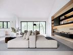 Super Green house plan living room — open-concept vaulted living area with large windows and deck access