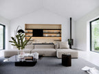 Super Green house plan living area — open-concept vaulted living room with daylight and deck access