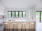 Super Green house plan kitchen — open-concept L-shaped kitchen with central island and natural light