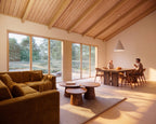 Minimalist living room with wood accents in 2 bed Japandi house plan