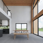 4 bedroom barndominium interior — floor-to-ceiling sliding glass doors opening to the deck and view