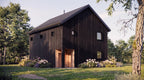 Garage with apartment plans rear elevation — two wood entry doors and black vertical wood siding
