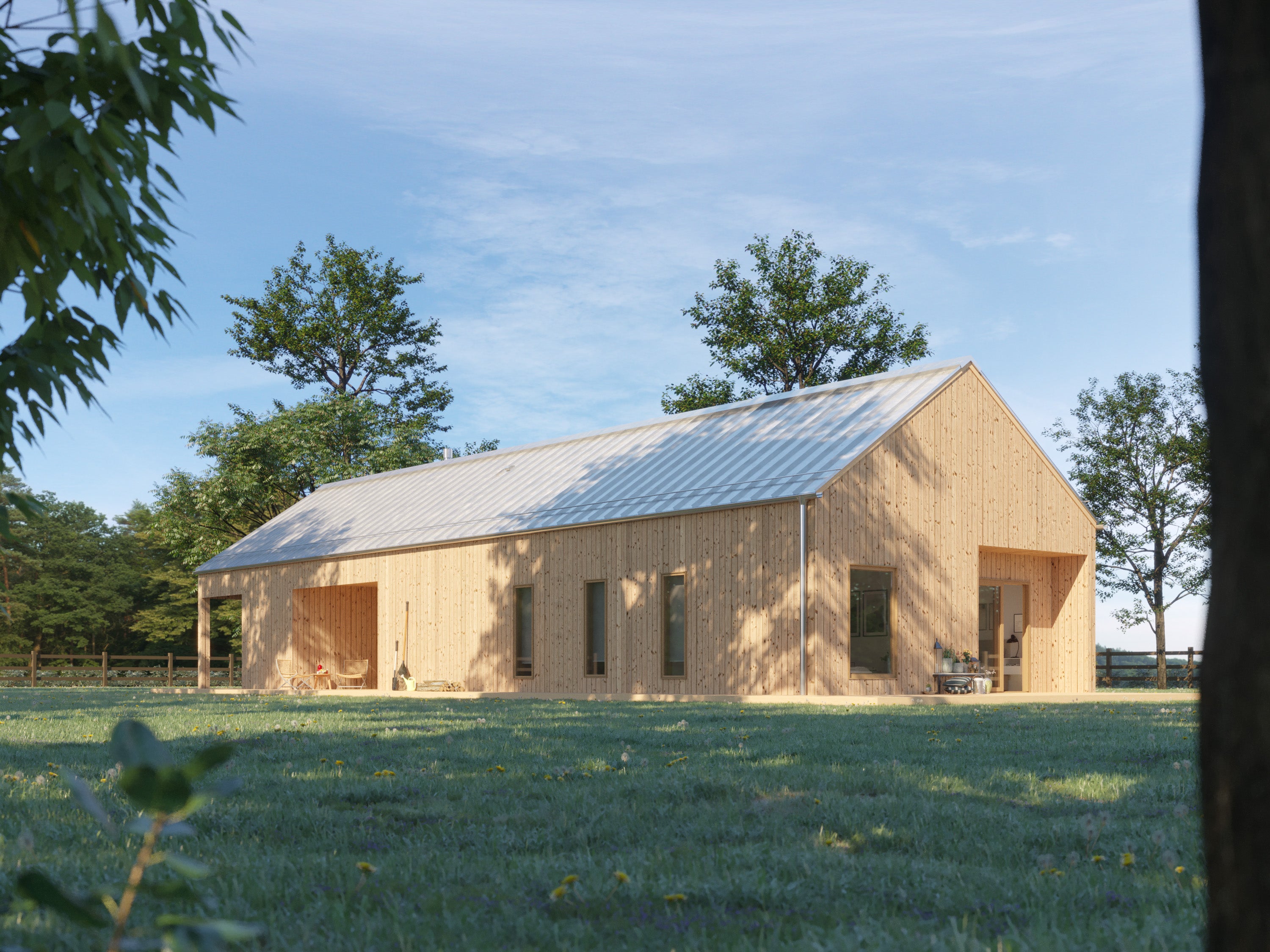 Scandinavian-style barn home with light natural wood vertical cladding and silver standing seam metal roof, set in green meadow on a sunny day