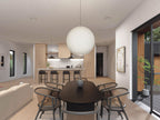 3 bedroom barndominium interior — open dining, kitchen island and living space with globe pendant lighting