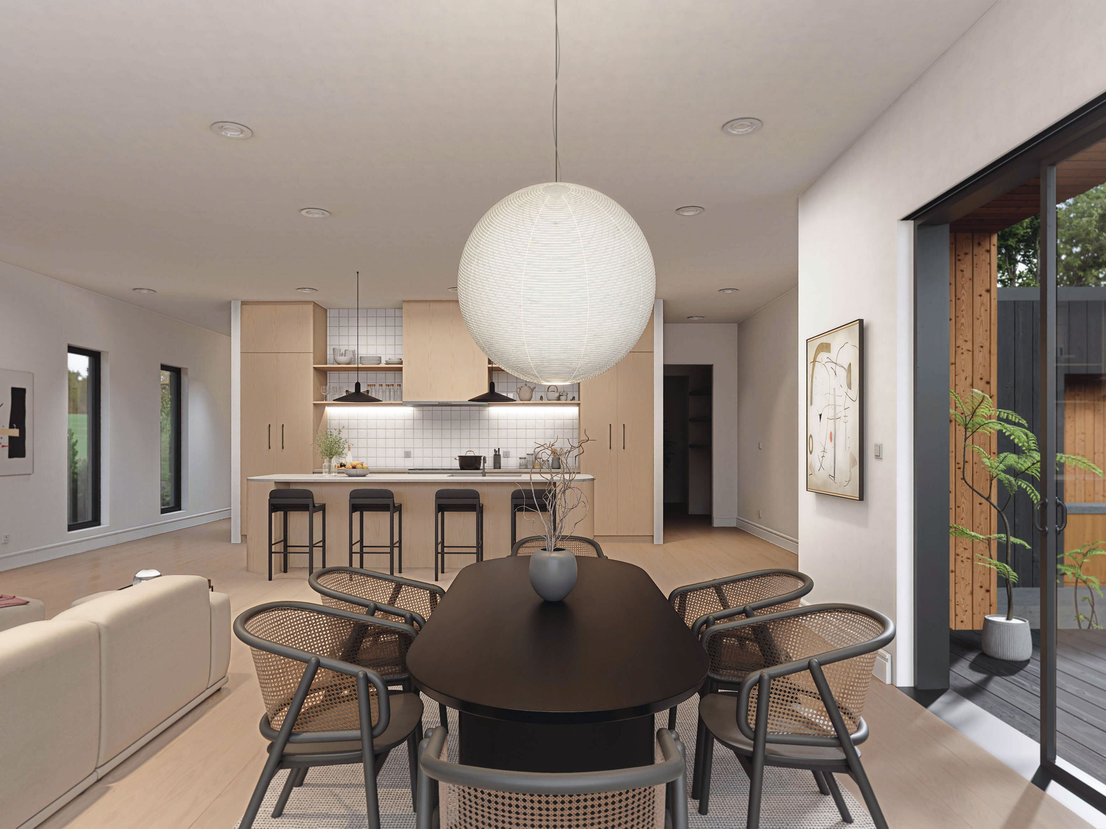 Barndominium floor plan interior showing dining area open to kitchen island and living space with globe pendant light