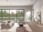 Modern barn house plan living room — floor-to-ceiling sliding doors with lake view and neutral sectional