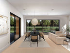 3 bedroom barndominium house plan — open-concept dining and living with sliding doors and lake view