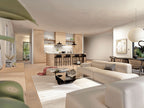 Barndominium open-concept living room — view to the kitchen island with light wood floors