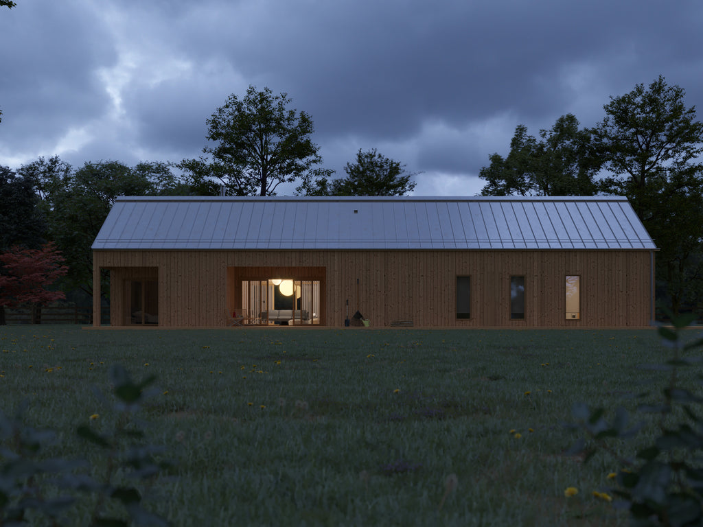 Modern barn-style house with vertical light wood cladding and standing seam metal roof at dusk, warm interior lights glowing through open living area