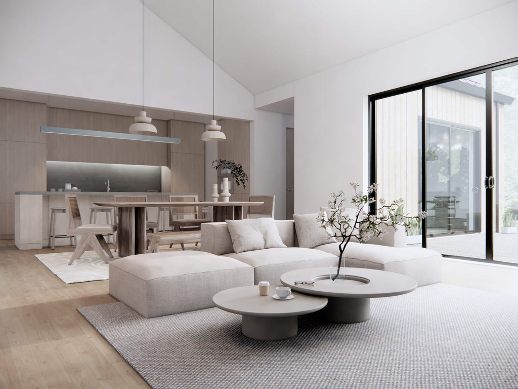 Modern farmhouse open concept living room looking through to dining area and kitchen with sliding glass doors to outdoor patio