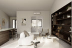 Modern open-concept living room with white curved sofa, dark wood built-in shelving, green marble kitchen island, mini-split AC unit, and French doors leading to covered porch – Design with Frank
