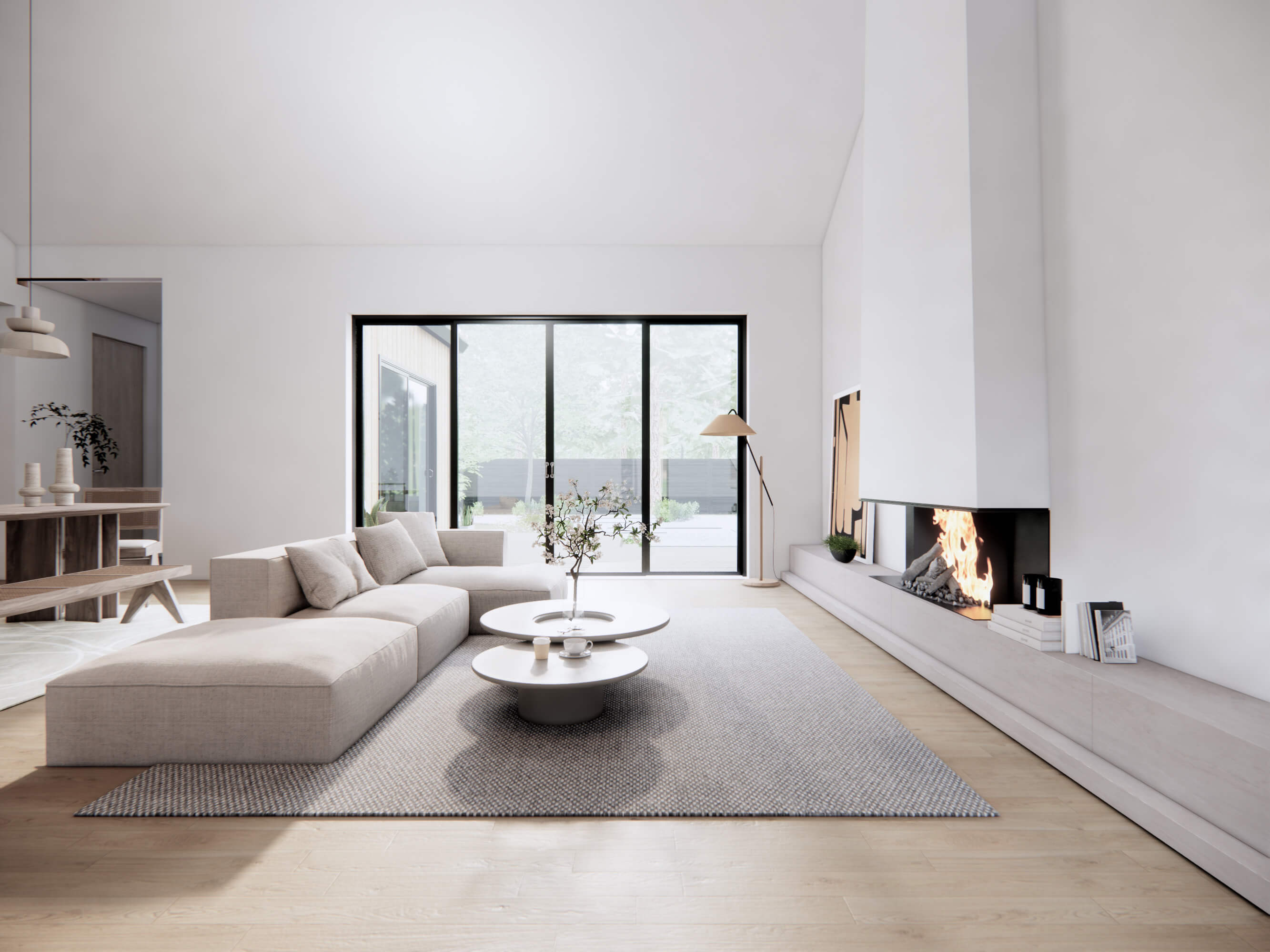 Southern modern house plan living room with vaulted ceiling, floor-to-ceiling fireplace, sectional sofa and sliding glass doors to backyard