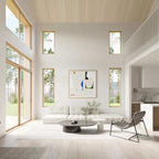 Barndominium interior — vaulted-ceiling living area with large windows and neutral tones