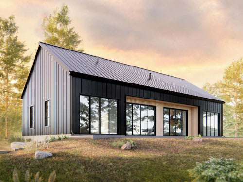 2 bed 2 bath modern cabin house plan exterior — 1,598 sqft rear elevation with floor-to-ceiling sliders and standing seam metal roof at sunset