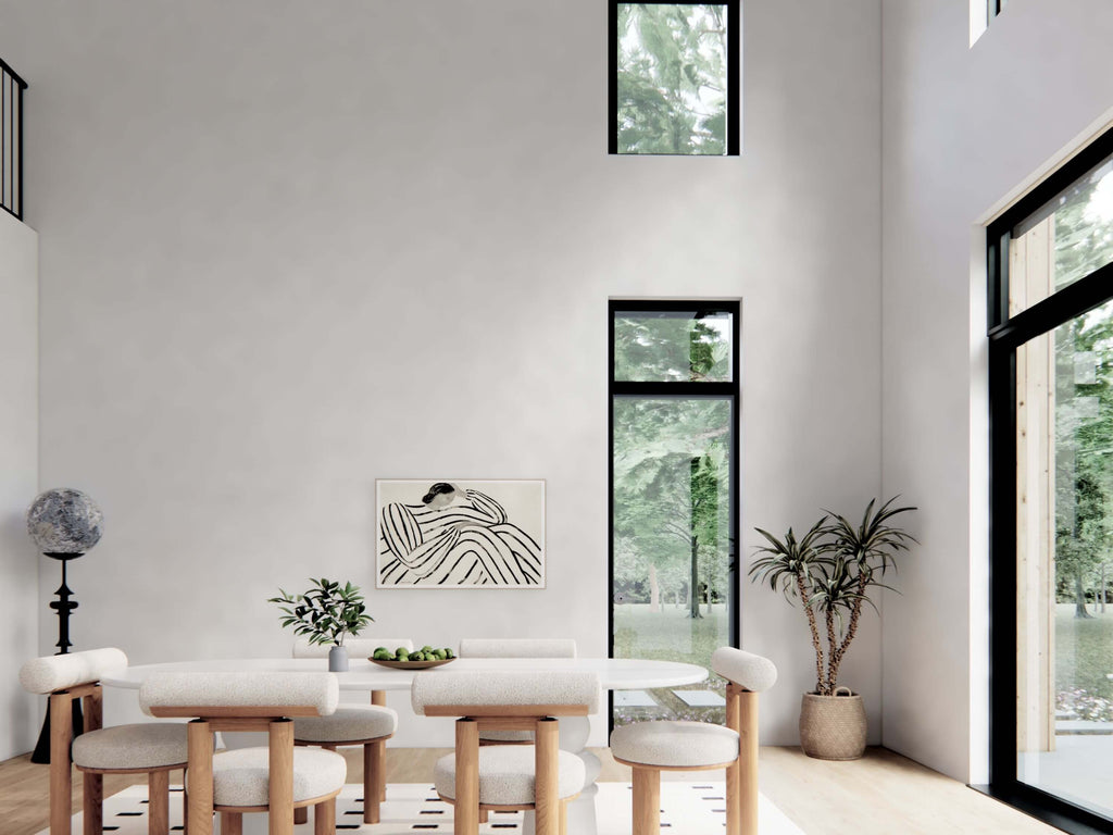 Nordic barndominium floor plan dining room with double-height black-frame windows, vaulted ceiling, white oval table and natural wood flooring