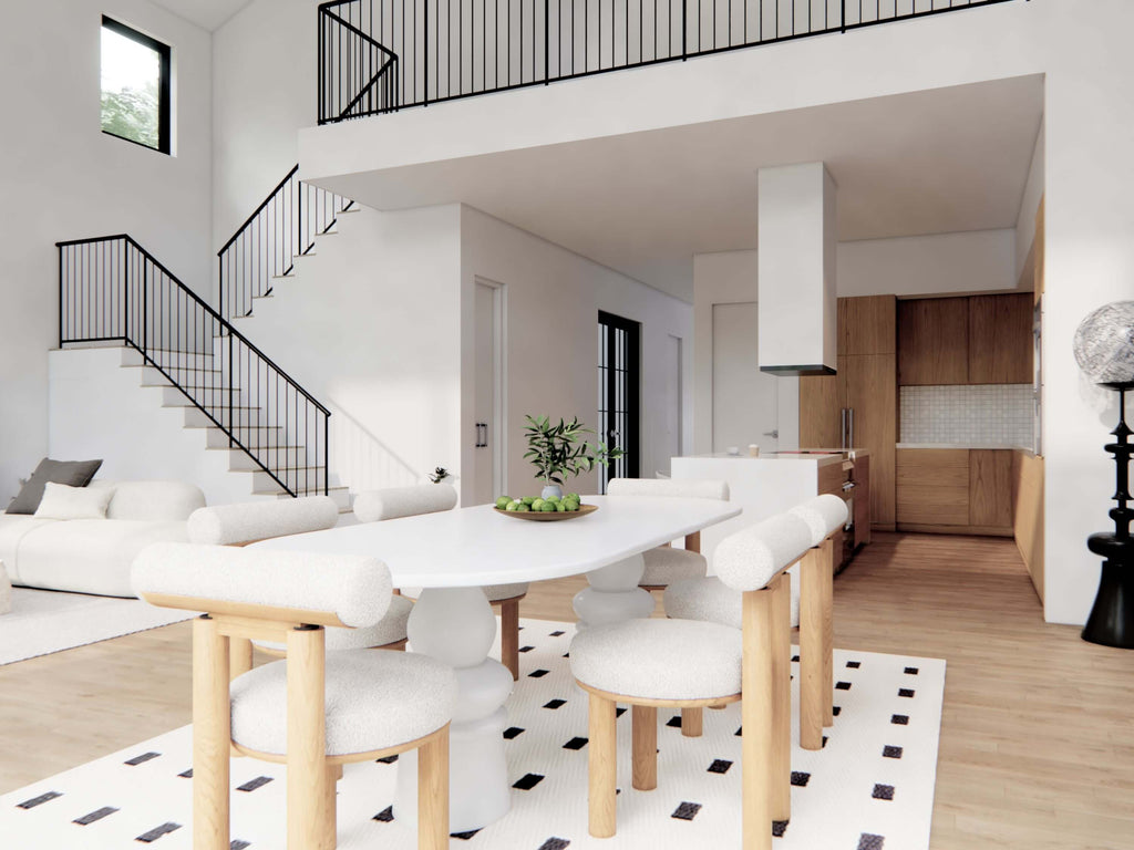 Nordic barndominium interior open concept dining area with loft overlook, black iron staircase, white oval table and kitchen visible in background