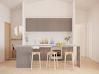 Compact eat-in island kitchen with pantry wall — 772 sqft vacation cabin plan interior